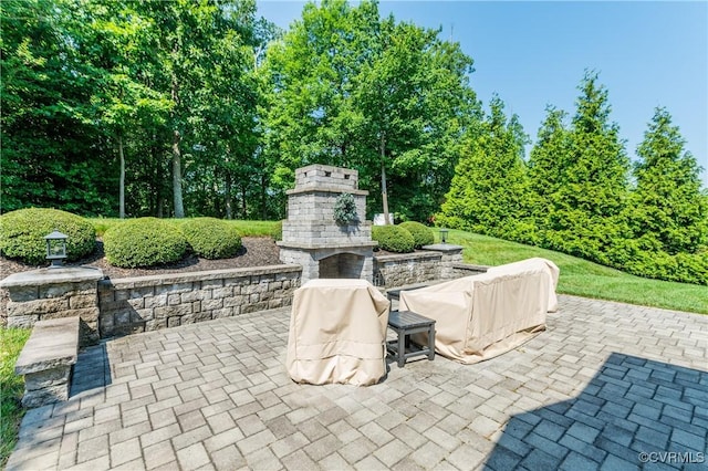 1240 Miners Trail Rd, Midlothian, VA 23114 - view of patio / terrace featuring an outdoor stone fireplace