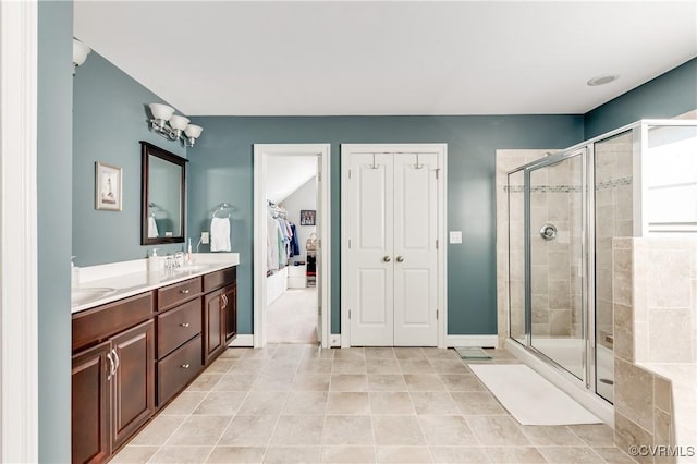 1240 Miners Trail Rd, Midlothian, VA 23114 - full bathroom with double vanity, a shower stall, tile patterned floors, and a walk in closet