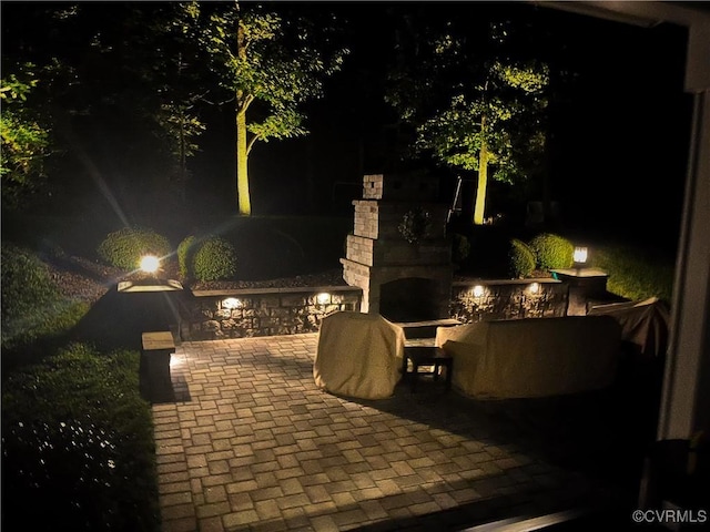 1240 Miners Trail Rd, Midlothian, VA 23114 - patio at night featuring a fireplace and a patio area
