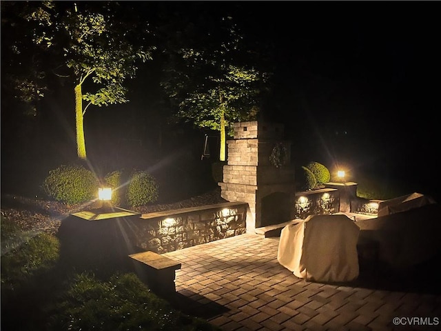 1240 Miners Trail Rd, Midlothian, VA 23114 - patio at twilight with a fireplace