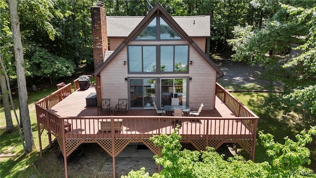 6131 Kellys Gln, Mineral, VA 23117 - rear view of property featuring a chimney, outdoor dining area, and a deck