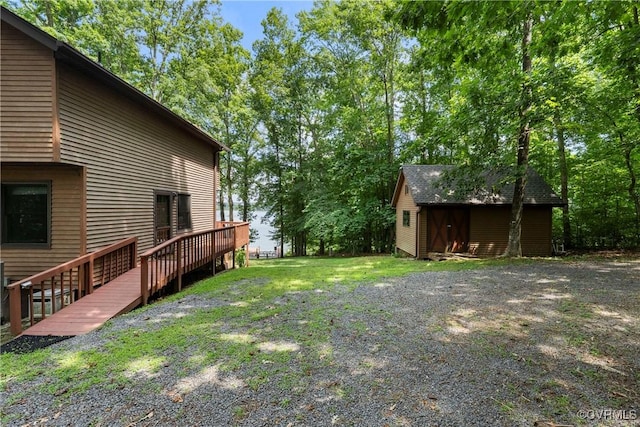 6131 Kellys Gln, Mineral, VA 23117 - view of yard featuring a deck and an outbuilding