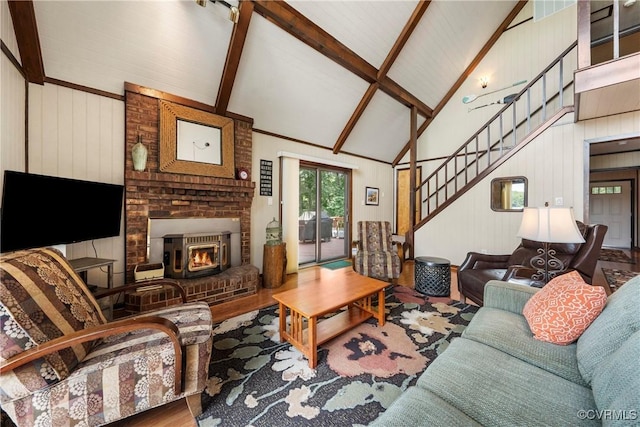 6131 Kellys Gln, Mineral, VA 23117 - living room with high vaulted ceiling, beam ceiling, a fireplace, stairway, and wood finished floors