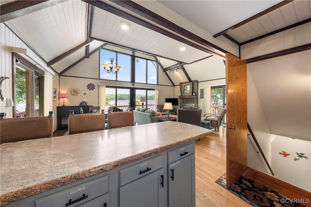 6131 Kellys Gln, Mineral, VA 23117 - kitchen with gray cabinets, light wood-style flooring, open floor plan, and light countertops