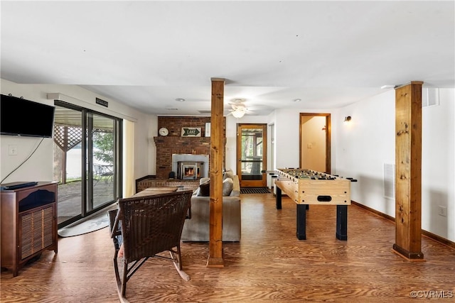 6131 Kellys Gln, Mineral, VA 23117 - game room featuring wood finished floors, a brick fireplace, and a ceiling fan