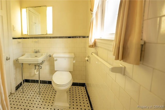 2276 Mosquito Point Rd, White Stone, VA 22578 - bathroom featuring wainscoting and tile walls