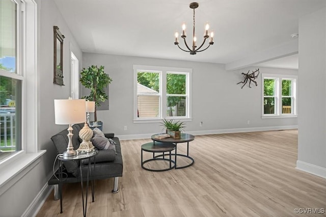 2227 S Whitehill Dr, Petersburg, VA 23803 - living area with healthy amount of natural light, light wood-style flooring, and a chandelier