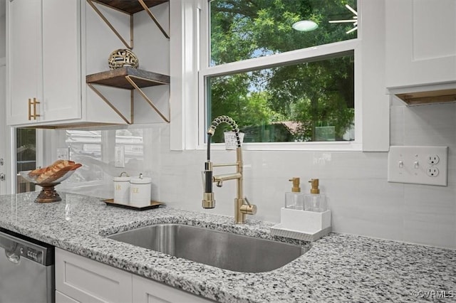 2227 S Whitehill Dr, Petersburg, VA 23803 - kitchen with stainless steel dishwasher, white cabinetry, decorative backsplash, and light stone countertops