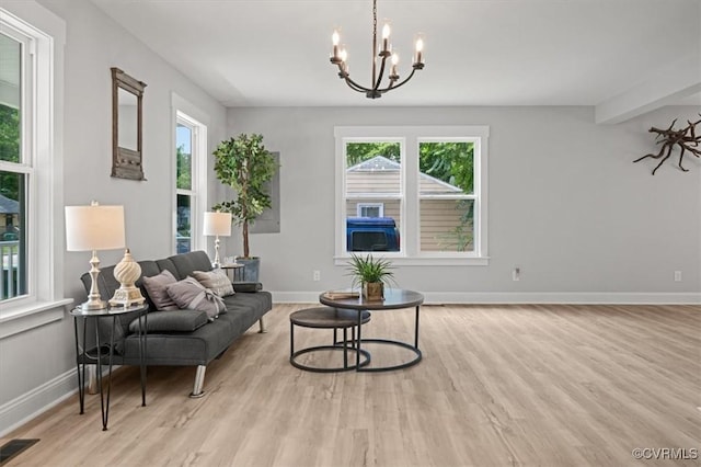 2227 S Whitehill Dr, Petersburg, VA 23803 - living area with light wood-style floors and a chandelier