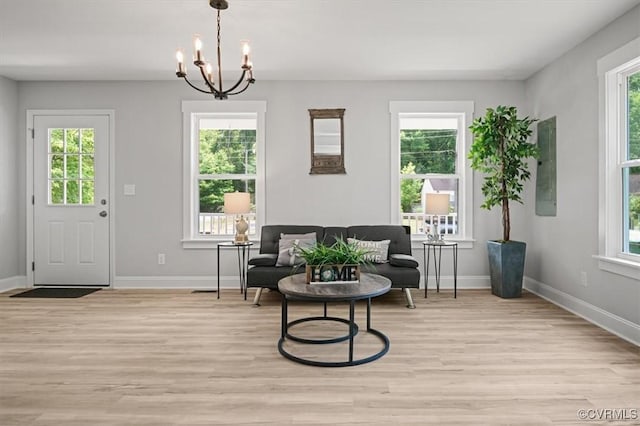2227 S Whitehill Dr, Petersburg, VA 23803 - sitting room with light wood-style floors, healthy amount of natural light, and a chandelier