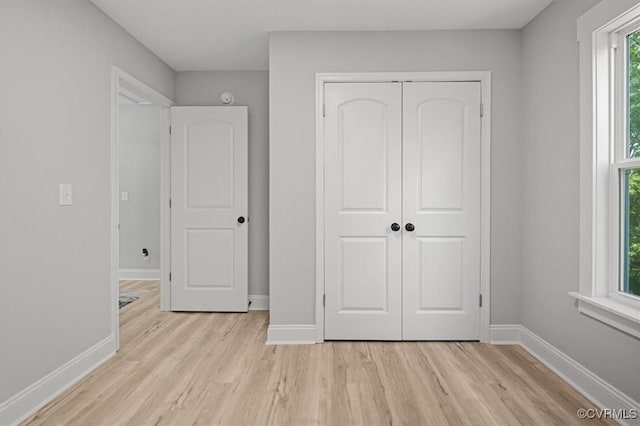 2227 S Whitehill Dr, Petersburg, VA 23803 - unfurnished bedroom featuring light wood-type flooring and a closet