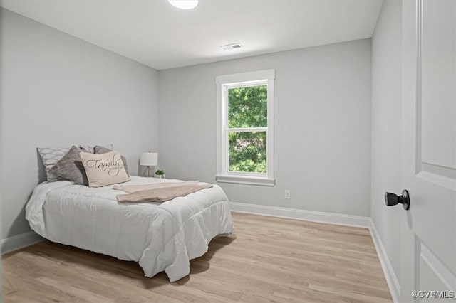 2227 S Whitehill Dr, Petersburg, VA 23803 - bedroom featuring light wood-style floors and baseboards
