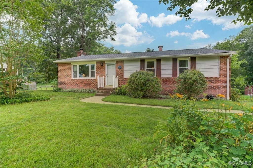 7993 Colony Dr, Mechanicsville, VA 23111 - ranch-style house featuring a chimney, brick siding, and a front lawn