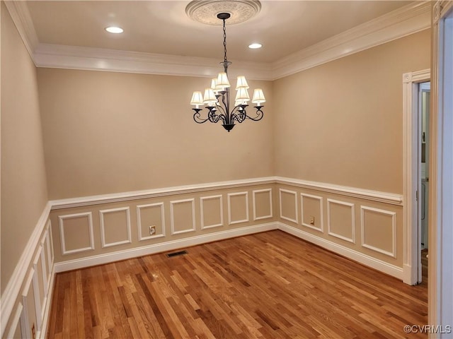 3902 Amberleigh Blvd, Chesterfield, VA 23236 - empty room with crown molding, a wainscoted wall, wood finished floors, a chandelier, and recessed lighting