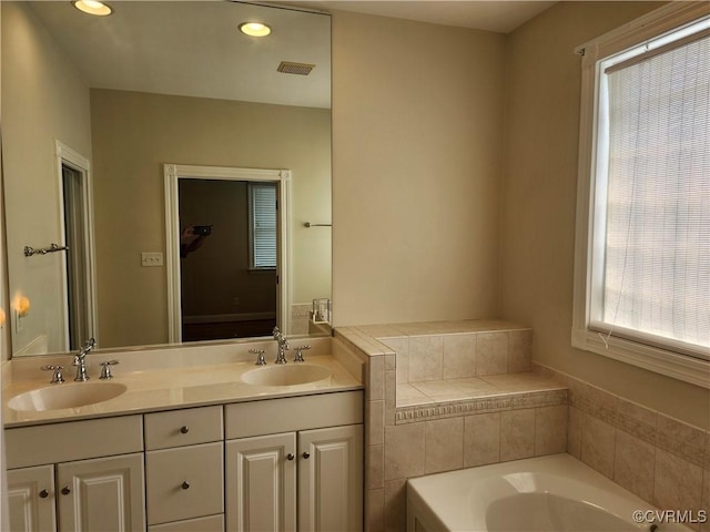 3902 Amberleigh Blvd, Chesterfield, VA 23236 - bathroom with a bath, double vanity, and recessed lighting