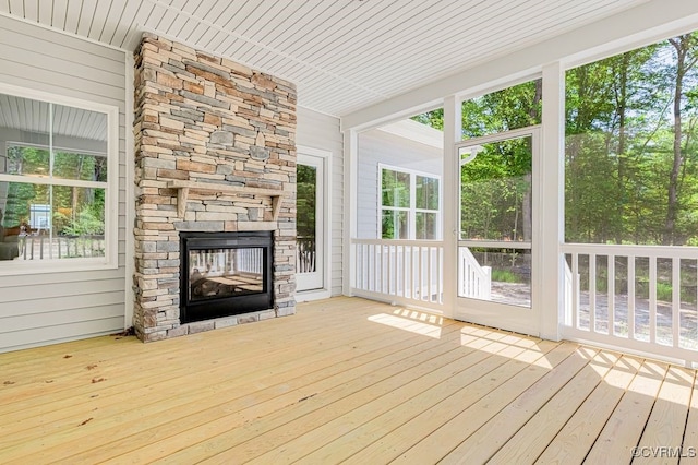 9157 Terroir Ln, New Kent, VA 23124 - unfurnished sunroom with a deck, wood walls, and wood-type flooring