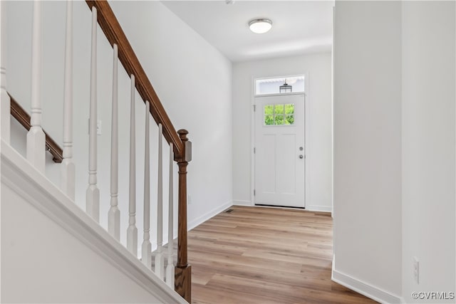 9130 Terroir Ln, New Kent, VA 23124 - foyer entrance with light wood-style flooring and stairs