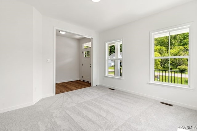 9130 Terroir Ln, New Kent, VA 23124 - empty room featuring carpet floors and plenty of natural light