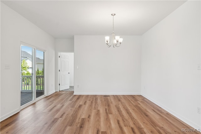 9130 Terroir Ln, New Kent, VA 23124 - unfurnished room featuring a chandelier and light wood finished floors