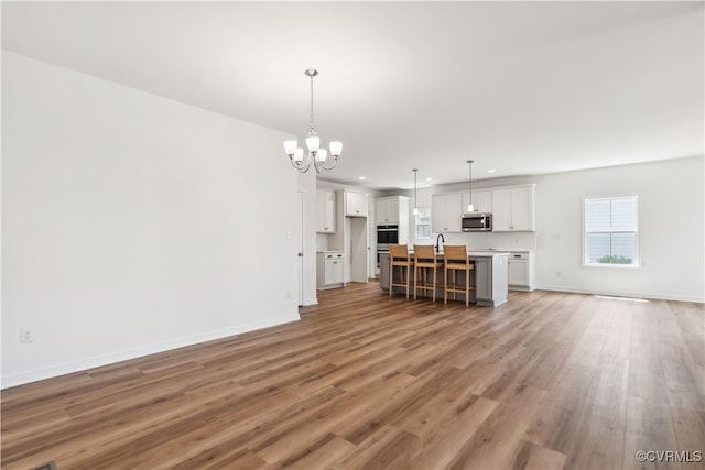 9130 Terroir Ln, New Kent, VA 23124 - living area with a chandelier, light wood-type flooring, and recessed lighting