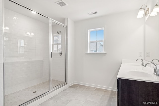 9130 Terroir Ln, New Kent, VA 23124 - full bathroom with double vanity, a shower stall, and tile patterned flooring
