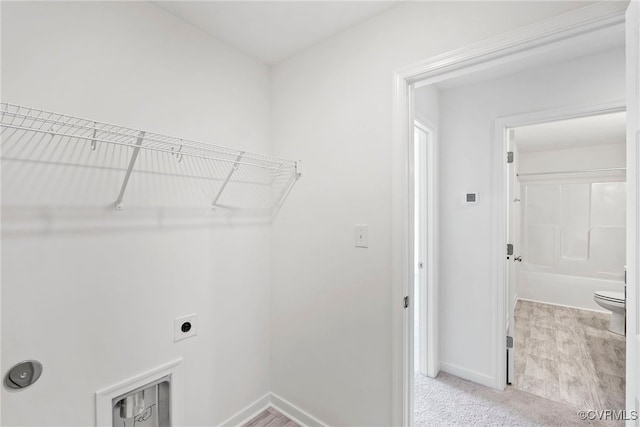 9131 Terroir Ln, New Kent, VA 23124 - washroom with electric dryer hookup and light colored carpet