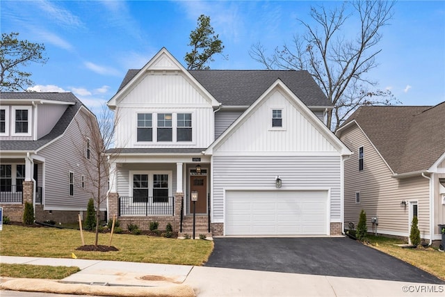 9131 Terroir Ln, New Kent, VA 23124 - craftsman-style home featuring board and batten siding, driveway, a garage, a porch, and a front lawn