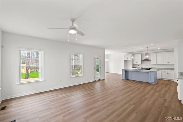 9131 Terroir Ln, New Kent, VA 23124 - unfurnished living room with a ceiling fan, light wood finished floors, and recessed lighting