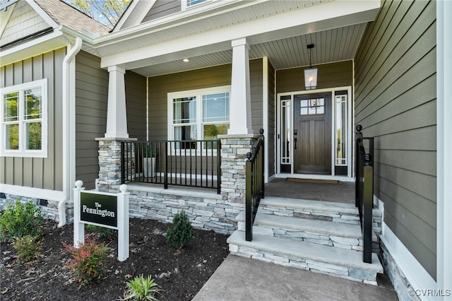 9066 Terroir Ln, New Kent, VA 23124 - entrance to property with board and batten siding and covered porch