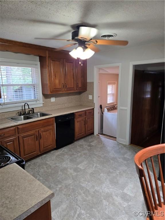 2707 Academy Rd, Powhatan, VA 23139 - kitchen featuring black dishwasher, ceiling fan, brown cabinets, light countertops, and a textured ceiling