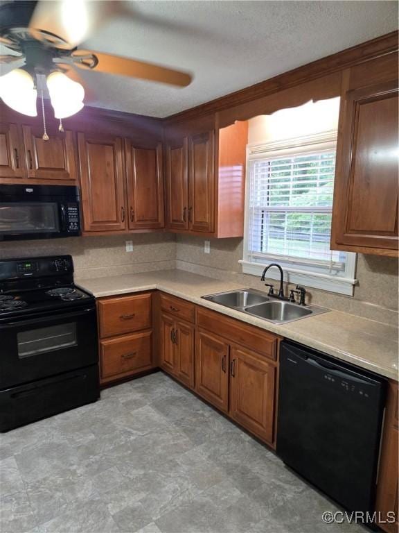 2707 Academy Rd, Powhatan, VA 23139 - kitchen featuring black appliances, a ceiling fan, light countertops, and brown cabinetry