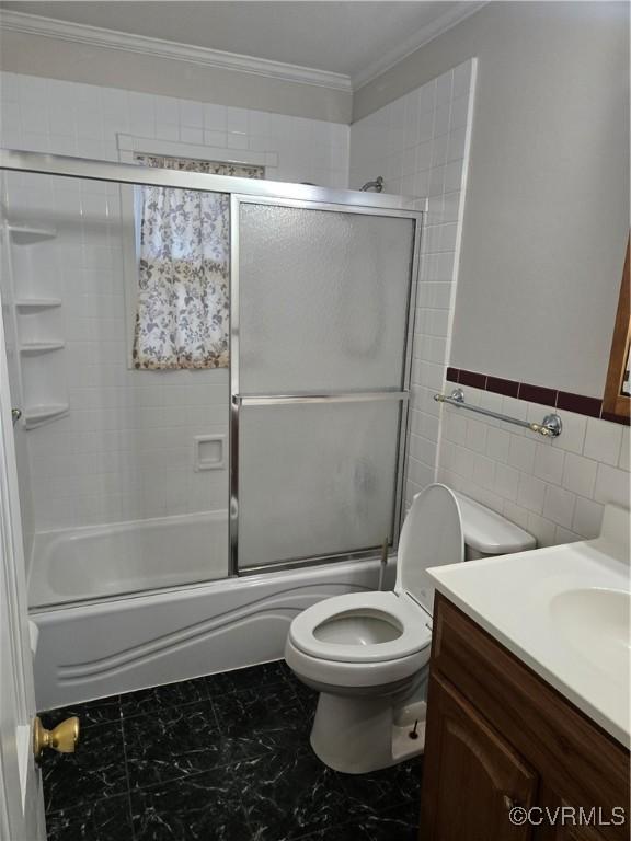 2707 Academy Rd, Powhatan, VA 23139 - full bathroom featuring vanity, crown molding, bath / shower combo with glass door, and tile walls