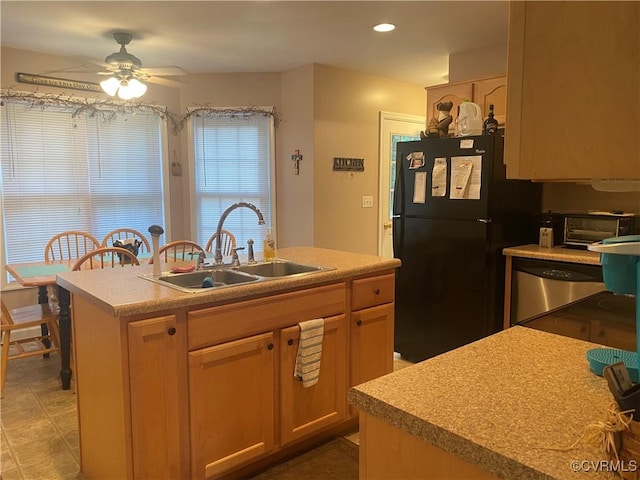 4554 Plank Rd, Kenbridge, VA 23944 - kitchen with freestanding refrigerator, ceiling fan, dishwasher, light countertops, and a kitchen island with sink