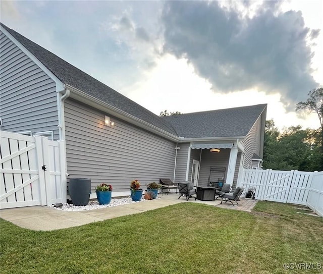 12468 Side Saddle Ln, Ashland, VA 23005 - back of property with a gate, a patio, a fenced backyard, and a shingled roof