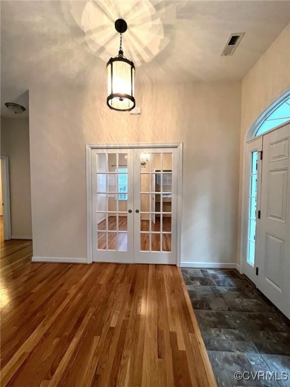 12468 Side Saddle Ln, Ashland, VA 23005 - foyer entrance featuring french doors, wood finished floors, and healthy amount of natural light