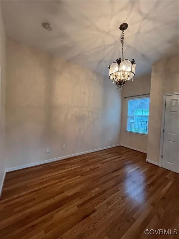 12468 Side Saddle Ln, Ashland, VA 23005 - unfurnished dining area featuring a chandelier and wood finished floors