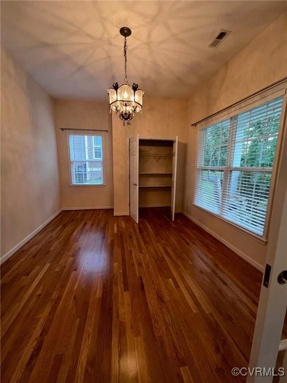 12468 Side Saddle Ln, Ashland, VA 23005 - unfurnished dining area featuring a chandelier and wood finished floors