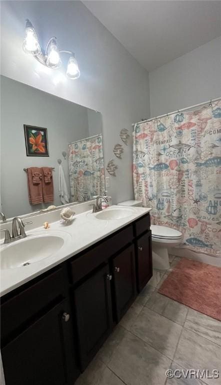 12468 Side Saddle Ln, Ashland, VA 23005 - bathroom featuring double vanity, vaulted ceiling, tile patterned floors, and curtained shower