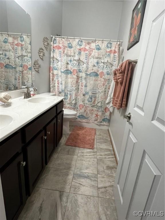 12468 Side Saddle Ln, Ashland, VA 23005 - bathroom featuring double vanity and curtained shower