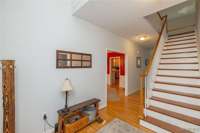 13813 Bluff Ridge Dr, Chesterfield, VA 23838 - staircase with wood finished floors and a textured ceiling