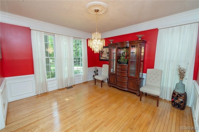 13813 Bluff Ridge Dr, Chesterfield, VA 23838 - sitting room with hardwood / wood-style flooring, a chandelier, wainscoting, ornamental molding, and a textured ceiling