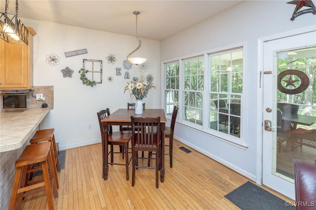 13813 Bluff Ridge Dr, Chesterfield, VA 23838 - dining area with light wood-type flooring and healthy amount of natural light