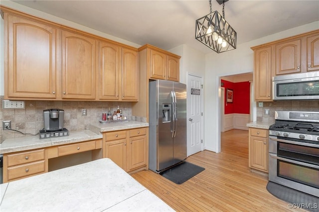 13813 Bluff Ridge Dr, Chesterfield, VA 23838 - kitchen with appliances with stainless steel finishes, light countertops, light wood-style floors, and a wainscoted wall