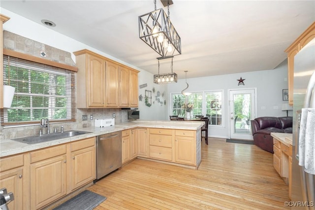 13813 Bluff Ridge Dr, Chesterfield, VA 23838 - kitchen featuring stainless steel dishwasher, a peninsula, light brown cabinetry, tasteful backsplash, and light wood-style flooring