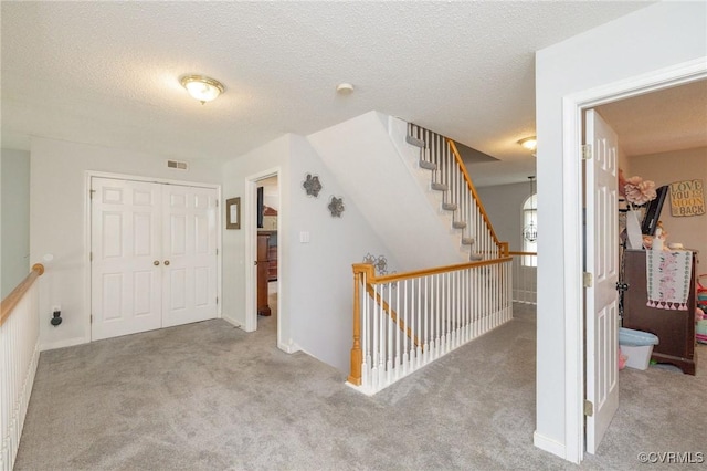 13813 Bluff Ridge Dr, Chesterfield, VA 23838 - hall featuring carpet, an upstairs landing, and a textured ceiling