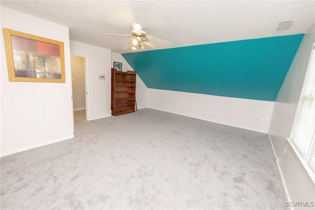 13813 Bluff Ridge Dr, Chesterfield, VA 23838 - bonus room featuring a ceiling fan, carpet flooring, vaulted ceiling, and a textured ceiling
