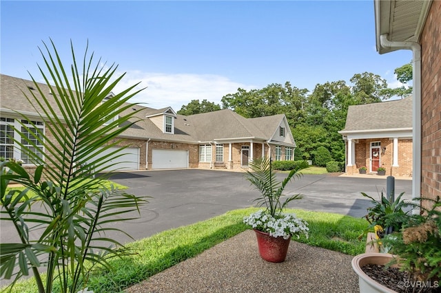 5915 E Stonepath Garden Dr, Chester, VA 23831 - view of yard with asphalt driveway and an attached garage