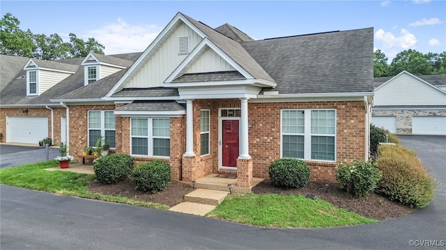 5915 E Stonepath Garden Dr, Chester, VA 23831 - view of front facade with brick siding, board and batten siding, and a shingled roof