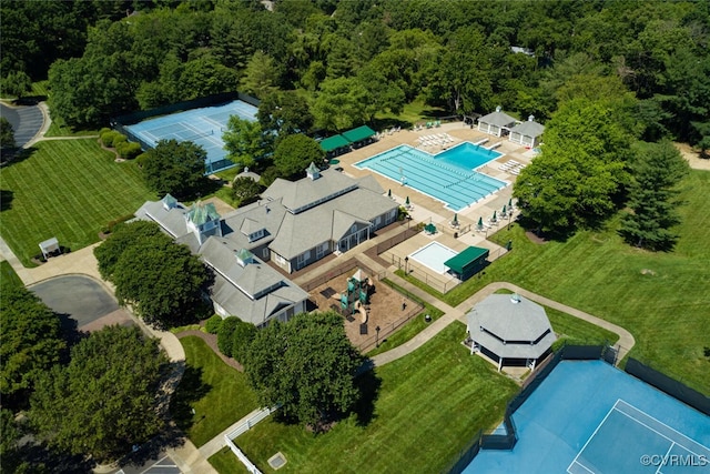 13009 Huntsteed Ct, Henrico, VA 23233 - drone / aerial view of a pool area and a heavily wooded area