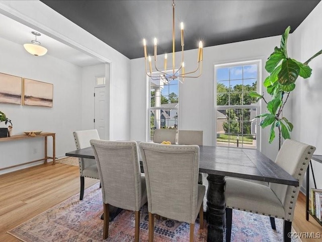 9913 Craftsbury Dr, Midlothian, VA 23112 - dining room with a chandelier and light wood finished floors